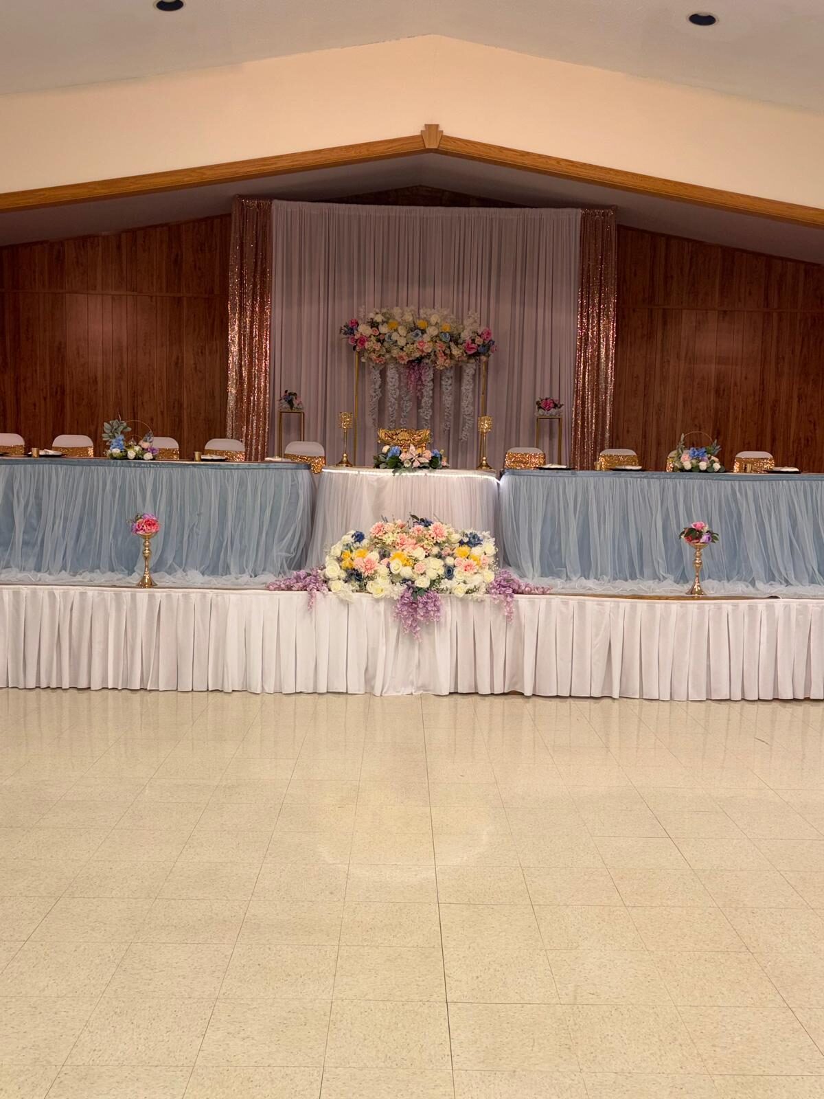 Head table with blue linens, pastel flowers and draped backdrop, event decoration in Lebanon, PA
